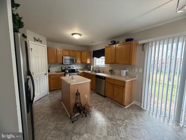 5534 Rockfish Way Clinton, MD 20735 - Photo 20 of 46 a kitchen with a refrigerator a stove top oven a sink dishwasher and a refrigerator