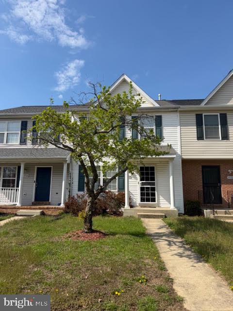5534 Rockfish Way Clinton, MD 20735 - Photo 2 of 46 a front view of a house with a garden