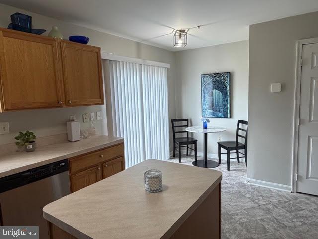 5534 Rockfish Way Clinton, MD 20735 - Photo 25 of 46 a kitchen with kitchen island a sink table and chairs