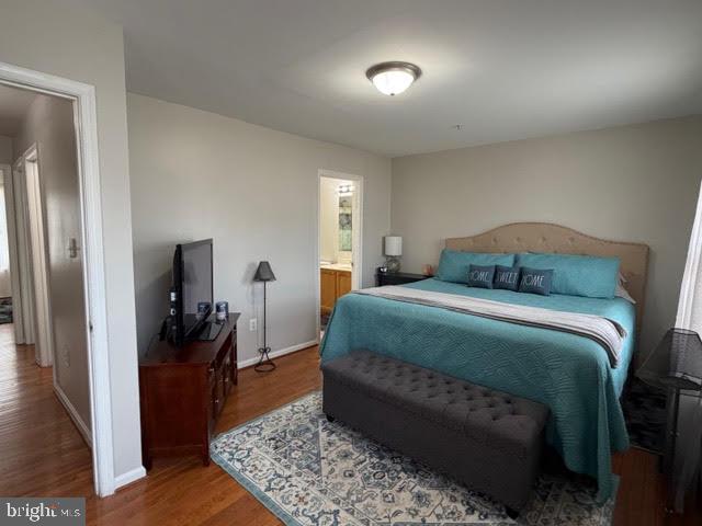 5534 Rockfish Way Clinton, MD 20735 - Photo 30 of 46 a bedroom with a bed and a rug