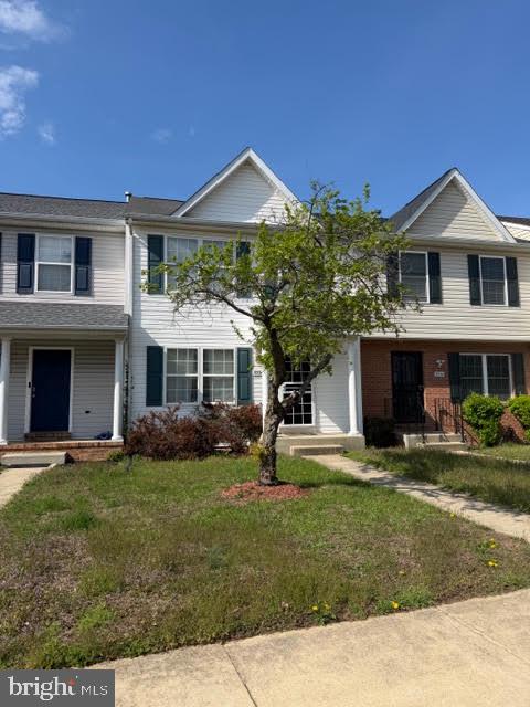 5534 Rockfish Way Clinton, MD 20735 - Photo 3 of 46 a front view of a house with a yard
