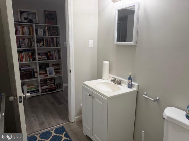 5534 Rockfish Way Clinton, MD 20735 - Photo 42 of 46 a bathroom with a sink toilet and vanity
