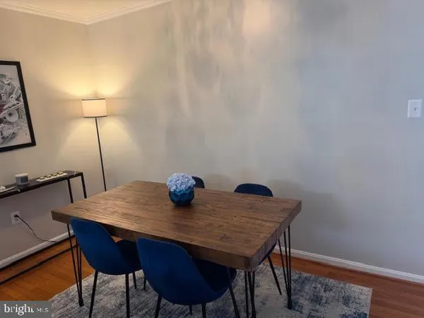 a view of a table and chairs in the room