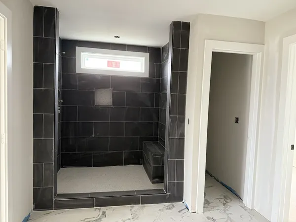 a view of an empty room with a closet