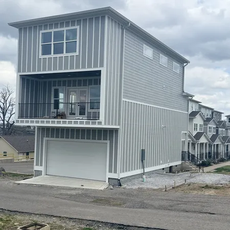 a view of front of house with a yard