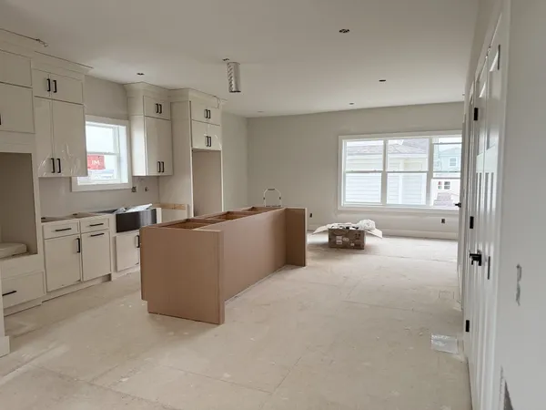 a kitchen with stainless steel appliances a refrigerator and a stove