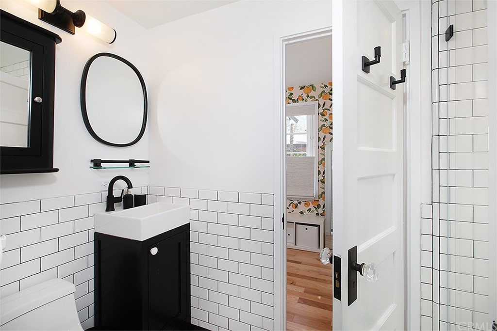 535 Through Street Laguna Beach, CA 92651 - Photo 11 of 23 a bathroom with a sink and a mirror