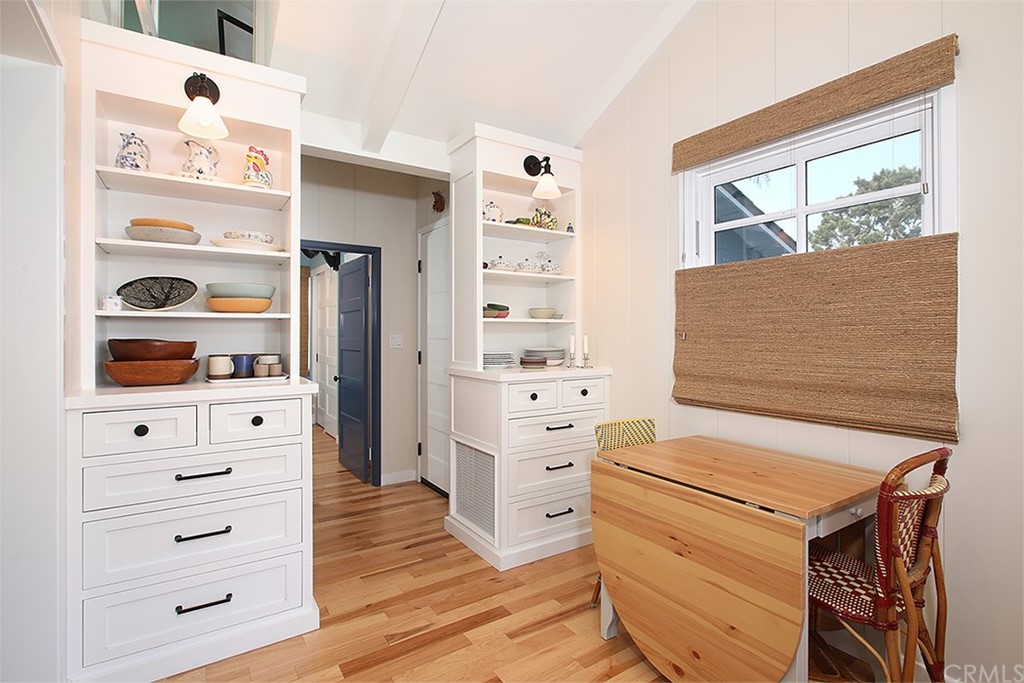 535 Through Street Laguna Beach, CA 92651 - Photo 4 of 23 a room with a dresser and a wooden floor