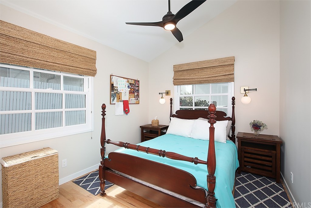 535 Through Street Laguna Beach, CA 92651 - Photo 10 of 23 a bedroom with a bed and wooden floor