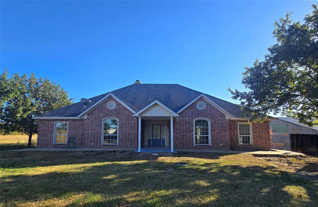 6559 Fm 2068 Commerce, TX 75428 - Photo 1 of 35 a view of a yard in front of a house with large trees