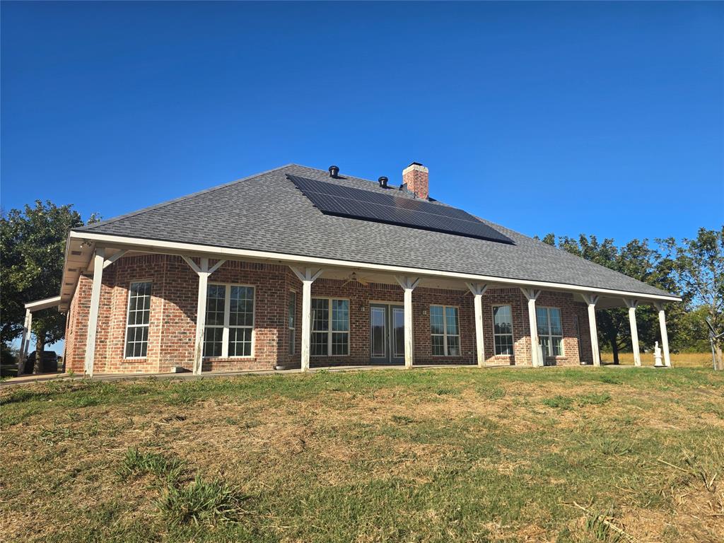 6559 Fm 2068 Commerce, TX 75428 - Photo 11 of 35 a front view of a house with a garden