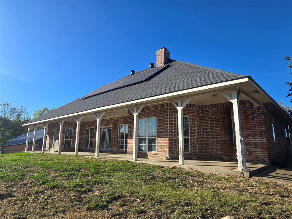 6559 Fm 2068 Commerce, TX 75428 - Photo 12 of 35 a view of a house with a yard