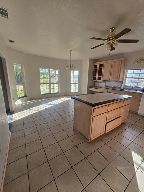 6559 Fm 2068 Commerce, TX 75428 - Photo 15 of 35 a kitchen with stainless steel appliances granite countertop a stove a sink and a refrigerator
