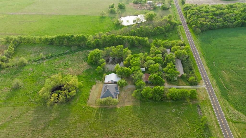 6559 Fm 2068 Commerce, TX 75428 - Photo 15 of 40 a view of a lake with a yard