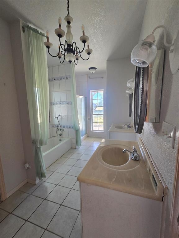 6559 Fm 2068 Commerce, TX 75428 - Photo 18 of 35 a bathroom with a sink a bathtub and a shower