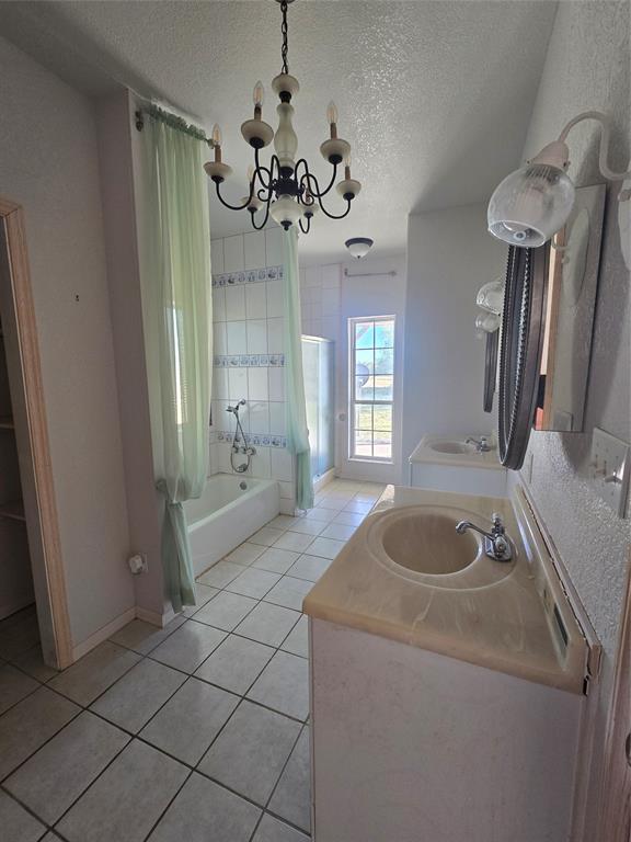 6559 Fm 2068 Commerce, TX 75428 - Photo 19 of 35 a bathroom with a granite countertop sink a toilet and mirror