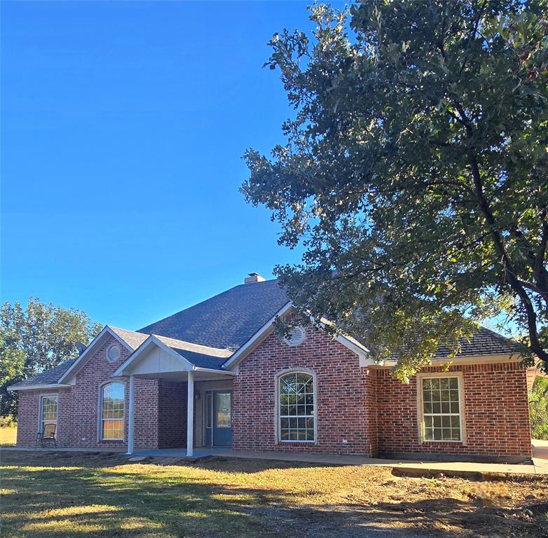 6559 Fm 2068 Commerce, TX 75428 - Photo 3 of 35 a front view of a house with a yard