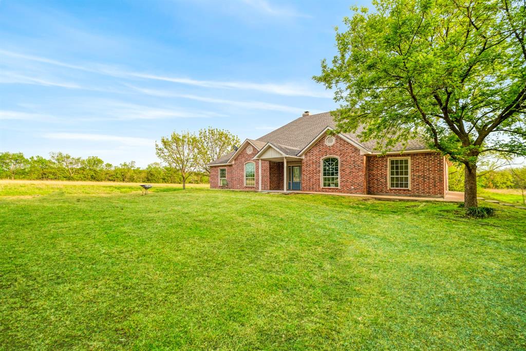 6559 Fm 2068 Commerce, TX 75428 - Photo 3 of 40 a view of a house with a yard