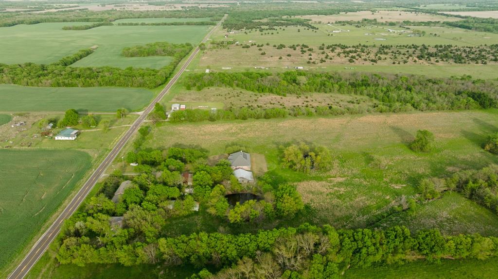 6559 Fm 2068 Commerce, TX 75428 - Photo 7 of 40 a view of a lake with a big yard