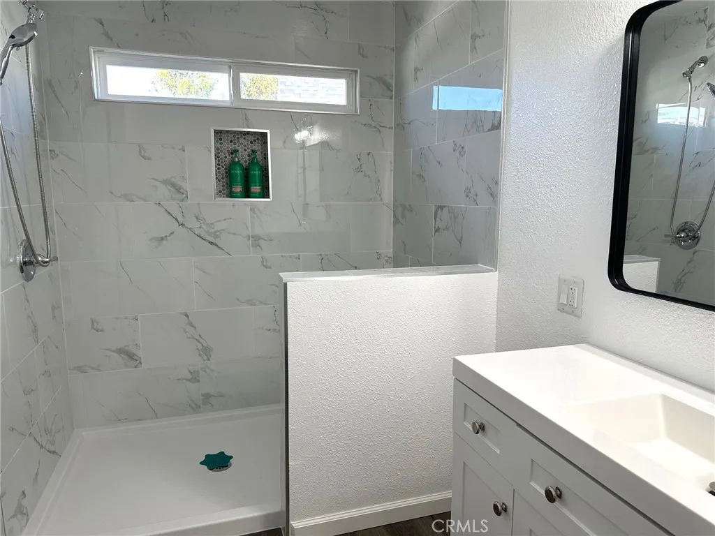 15181 Van Buren, Unit 57 Riverside, CA 92501 - Photo 19 of 38 a bathroom with a bathtub and a shower