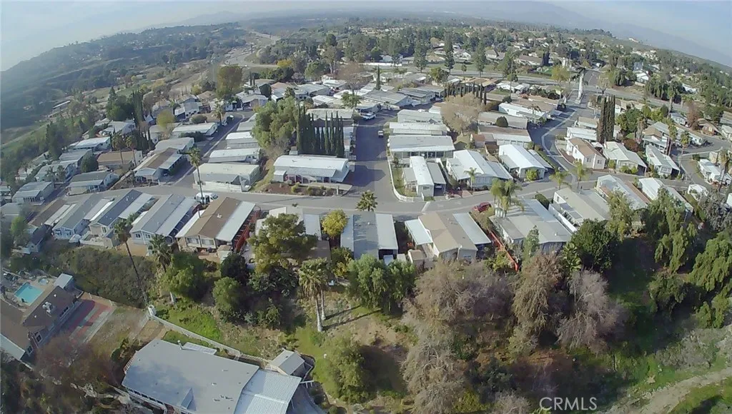 15181 Van Buren, Unit 57 Riverside, CA 92504 - Photo 21 of 38 an aerial view of residential houses with outdoor space