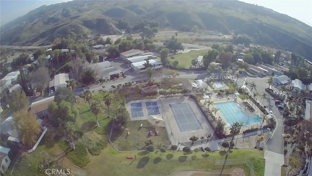 15181 Van Buren, Unit 57 Riverside, CA 92504 - Photo 22 of 38 a aerial view of a residential apartment building with a yard