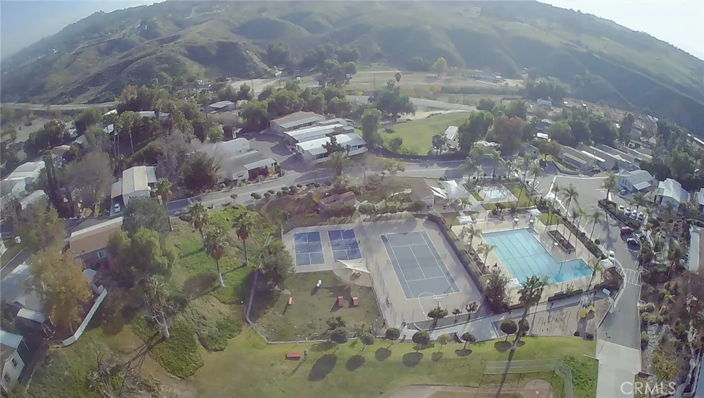 15181 Van Buren, Unit 57 Riverside, CA 92501 - Photo 22 of 38 a aerial view of a residential apartment building with a yard