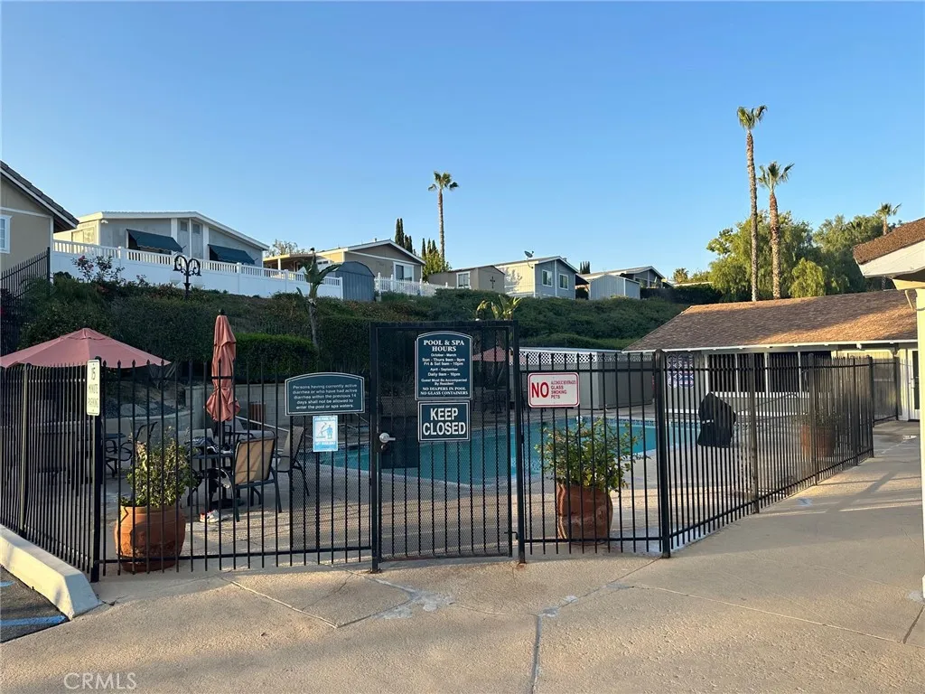 15181 Van Buren, Unit 57 Riverside, CA 92504 - Photo 25 of 38 a front view of a house with parking space