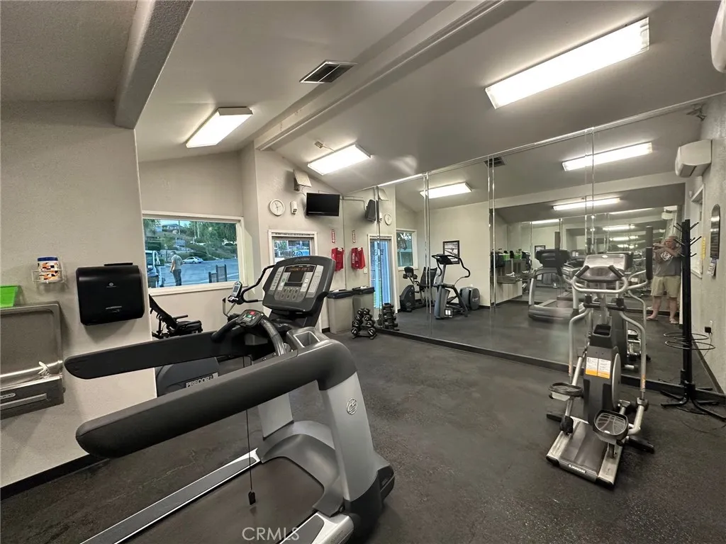 15181 Van Buren, Unit 57 Riverside, CA 92501 - Photo 36 of 38 a room with gym equipment and a large window