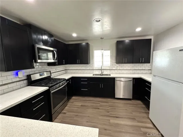 a spacious bedroom with a bed and window