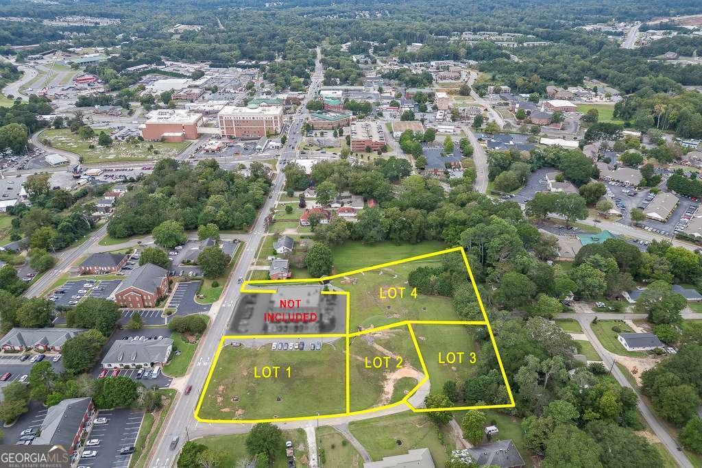 208 Pirkle Ferry Road Cumming, GA 30040 - Photo 3 of 14 an aerial view of residential houses with outdoor space