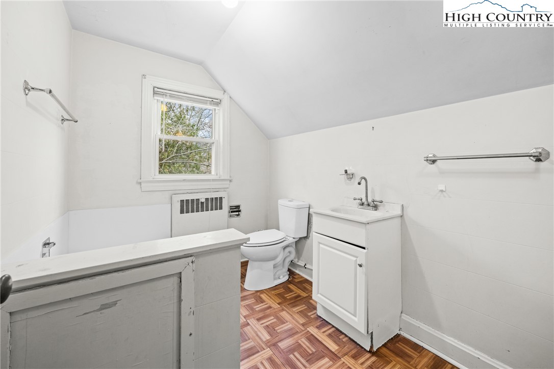 192-206 Orchard Street Boone, NC 28607 - Photo 17 of 50 a bathroom with a sink toilet and window