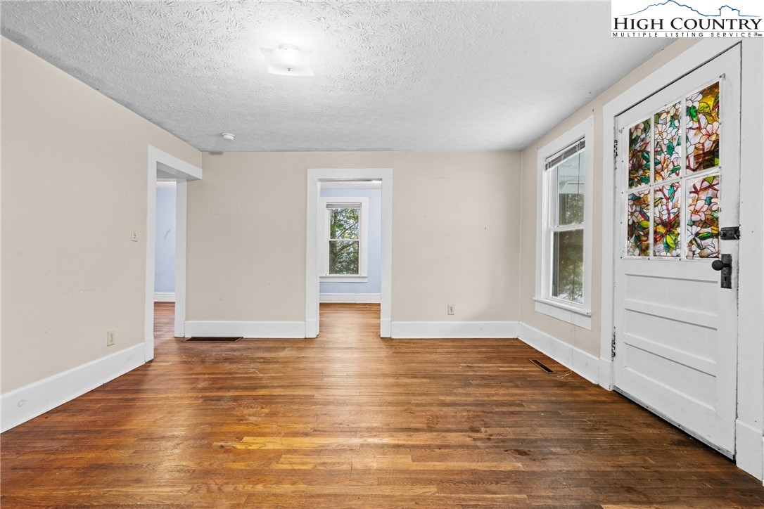192-206 Orchard Street Boone, NC 28607 - Photo 27 of 50 wooden floor in an empty room with a window