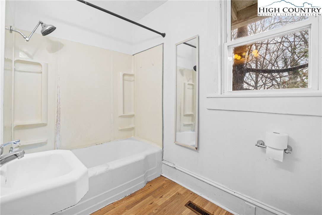 192-206 Orchard Street Boone, NC 28607 - Photo 37 of 50 a bathroom with a bathtub and a shower