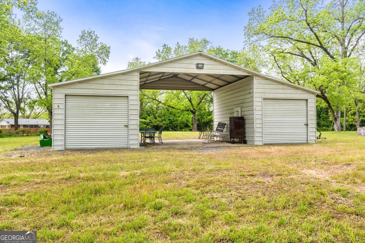 117 Zebulon Street Milner, GA 30257 - Photo 12 of 24 a front view of house with yard and trees in the background