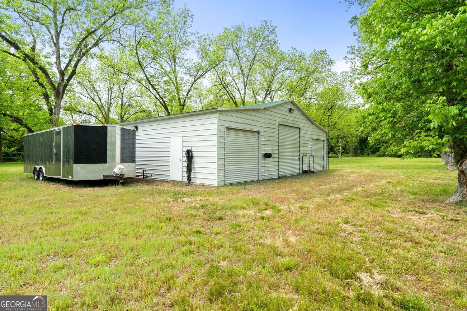 117 Zebulon Street Milner, GA 30257 - Photo 13 of 24 a view of a house with backyard and garden