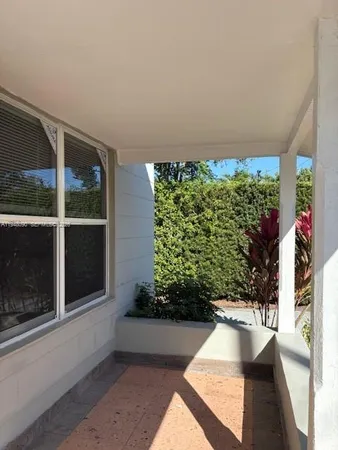 a kitchen with cabinets and window