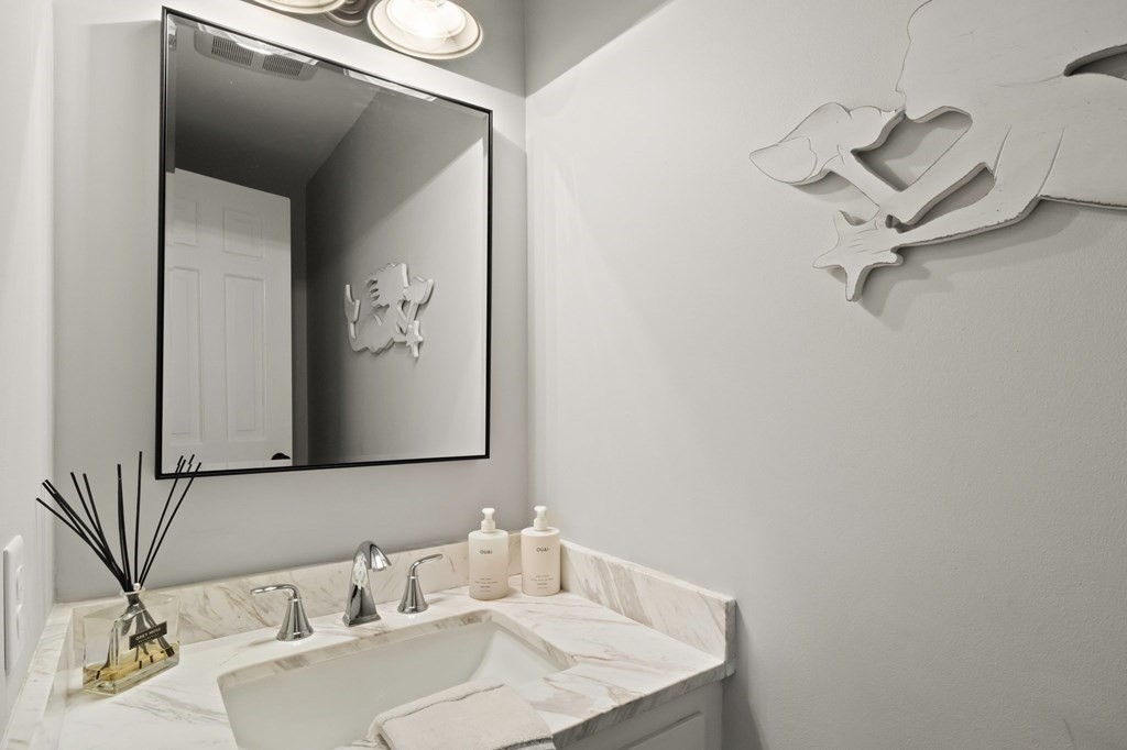 63 West Way Mashpee, MA 02649 - Photo 13 of 41 a bathroom with a sink and a mirror