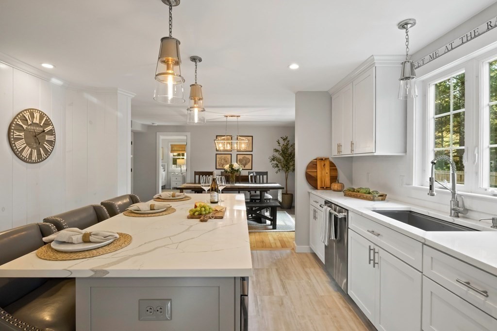 63 West Way Mashpee, MA 02649 - Photo 15 of 41 a kitchen with a sink stove and cabinets