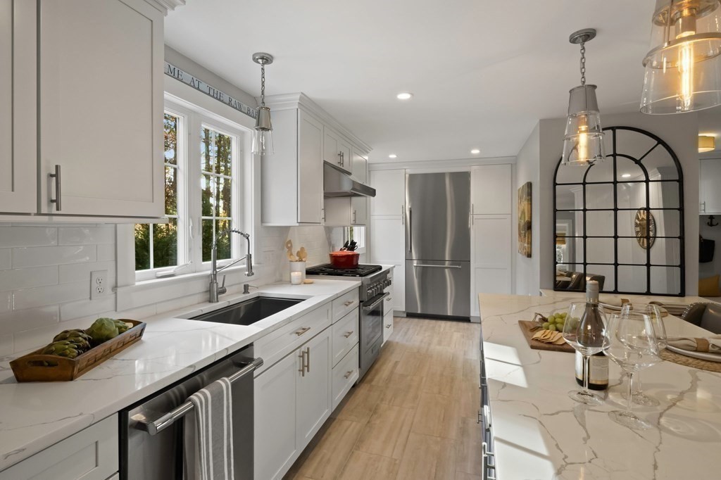 63 West Way Mashpee, MA 02649 - Photo 17 of 41 a kitchen with a sink and a stove top oven