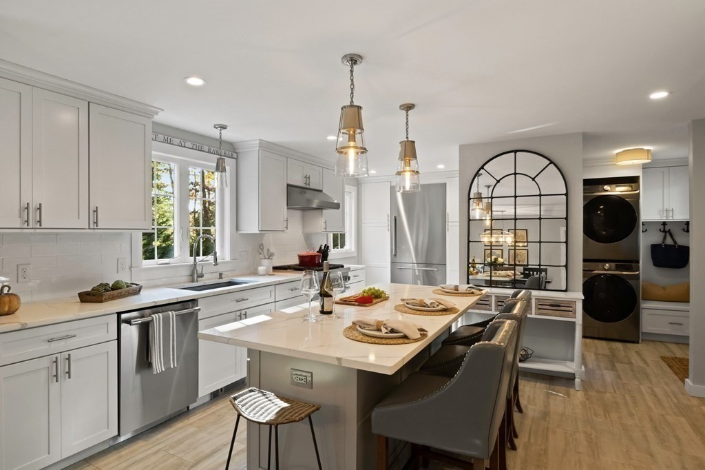 63 West Way Mashpee, MA 02649 - Photo 18 of 41 a view of a kitchen area with furniture and wooden floor