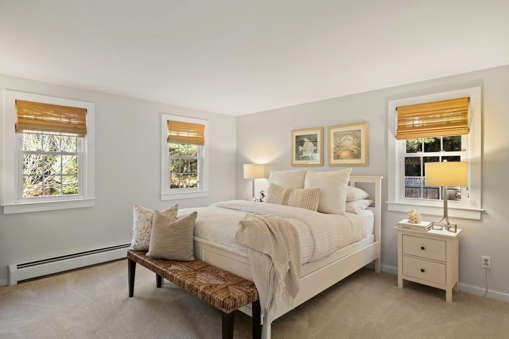 63 West Way Mashpee, MA 02649 - Photo 21 of 41 a bedroom with a bed and a table chair