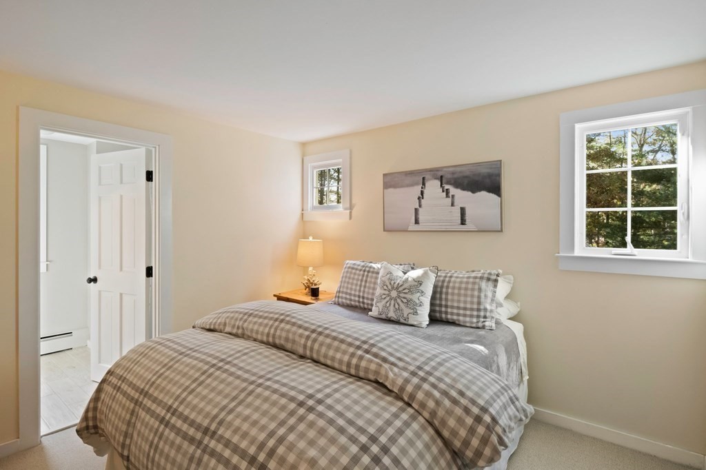 63 West Way Mashpee, MA 02649 - Photo 28 of 41 a bedroom with a bed and a window