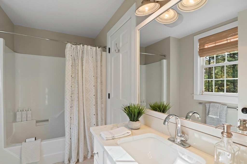 63 West Way Mashpee, MA 02649 - Photo 30 of 41 a bath room with a sink and a mirror