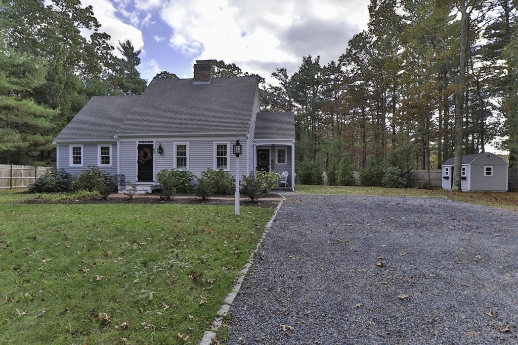 63 West Way Mashpee, MA 02649 - Photo 3 of 41 a view of a house with yard and a garden