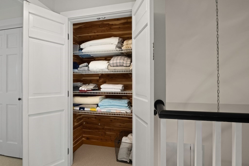 63 West Way Mashpee, MA 02649 - Photo 31 of 41 a view of walk in closet with clothes and shoes