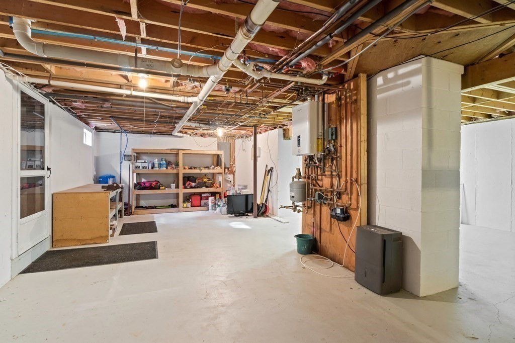 63 West Way Mashpee, MA 02649 - Photo 32 of 41 a view of a garage with storage