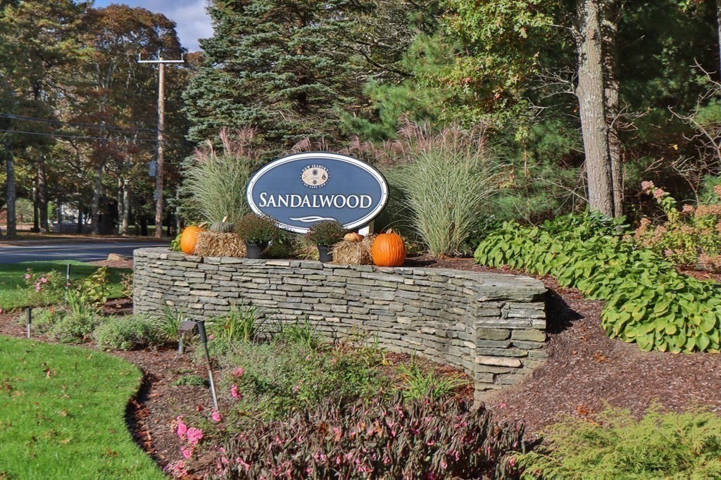 63 West Way Mashpee, MA 02649 - Photo 37 of 41 a sign that is sitting on a brick wall