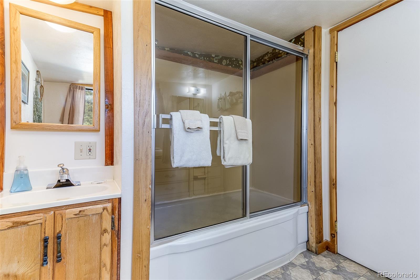 2220 Eagle Cliff Road Estes Park, CO 80517 - Photo 16 of 27 a bathroom with a shower and a sink