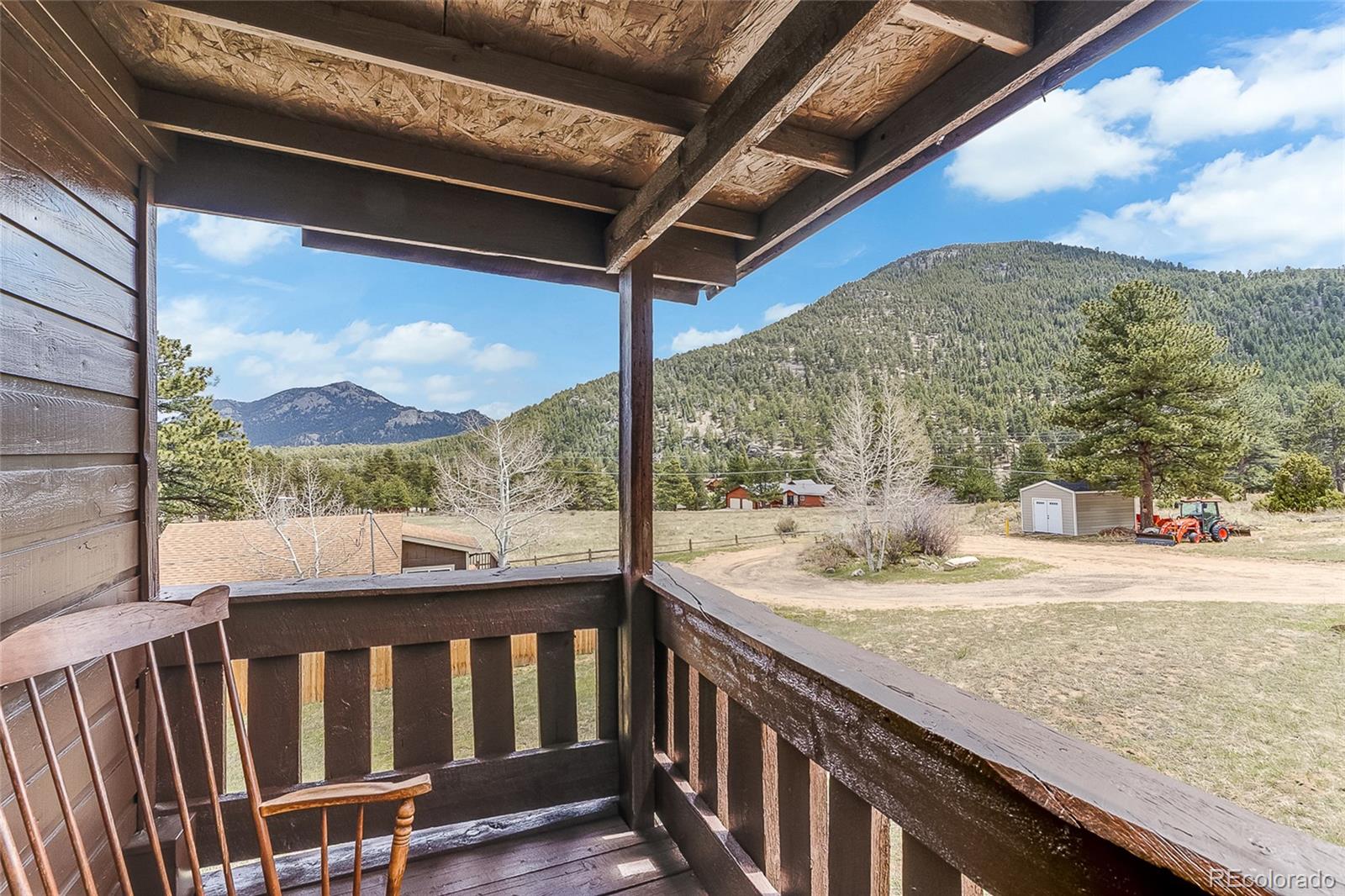 2220 Eagle Cliff Road Estes Park, CO 80517 - Photo 22 of 27 a view of roof deck with wooden floor and fence